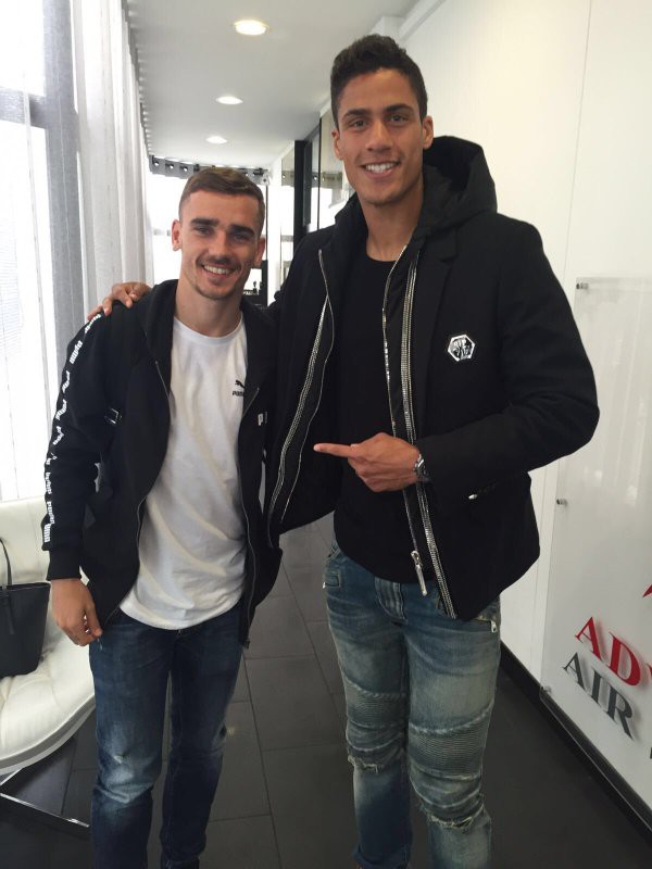 Antoine with Raphael Varane