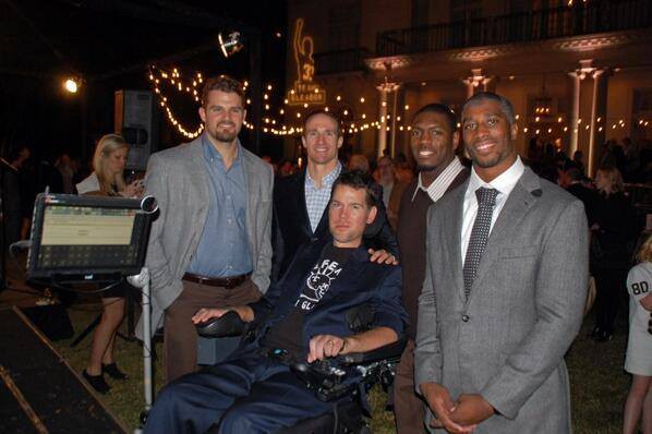 Drew Brees with fellow team mates at a fundraiser event