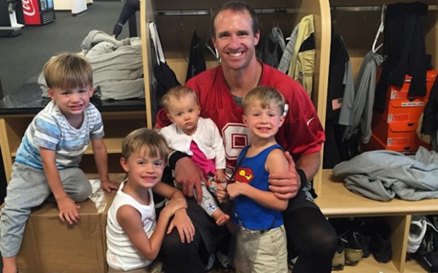 Drew Brees with his kids in dressing room