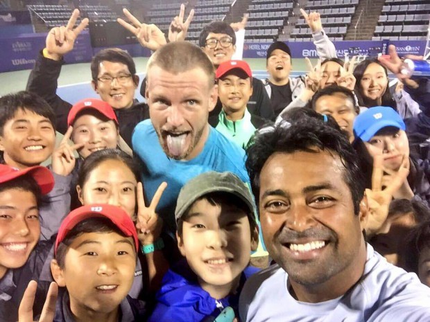 Paes and Sam Groth with kids