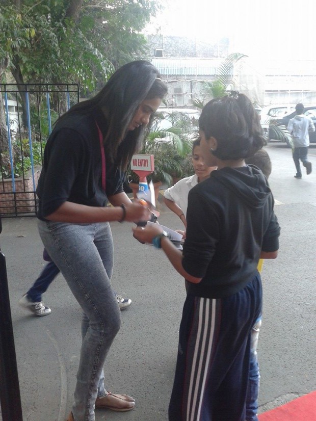 Sindhu signing autographs to her kid fans