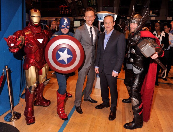 Tom with a reporter and some of the fans as avengers characters
